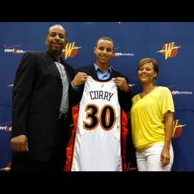 Golden State Warriors top draft pick Stephen Curry center poses with his parents Dell Curry who played 16 seasons in the MBA and his mother Sonya Curry after a press conference at Warriors headquarters in Oakland, Calif, Friday, June 26, 2009.